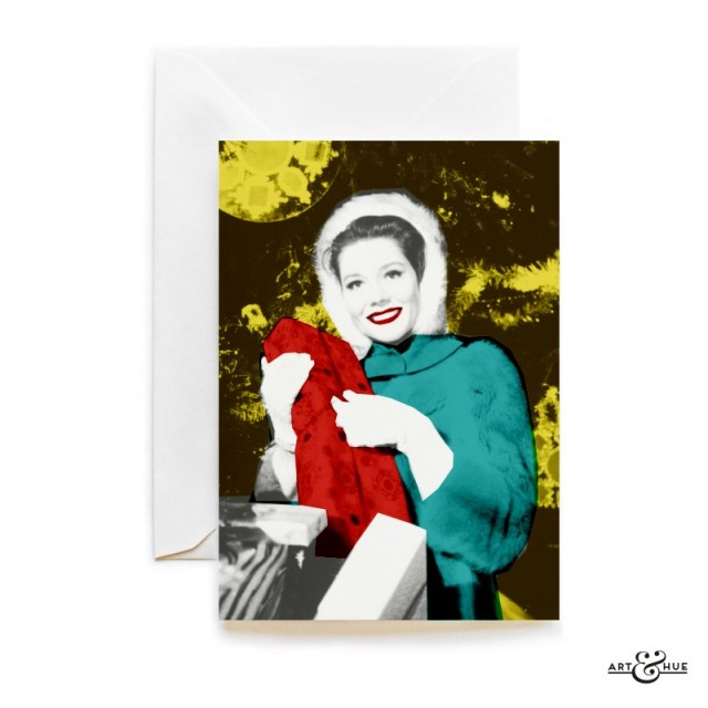Merry Xmas with Emma Peel unwrapping a Christmas gift by Art & Hue